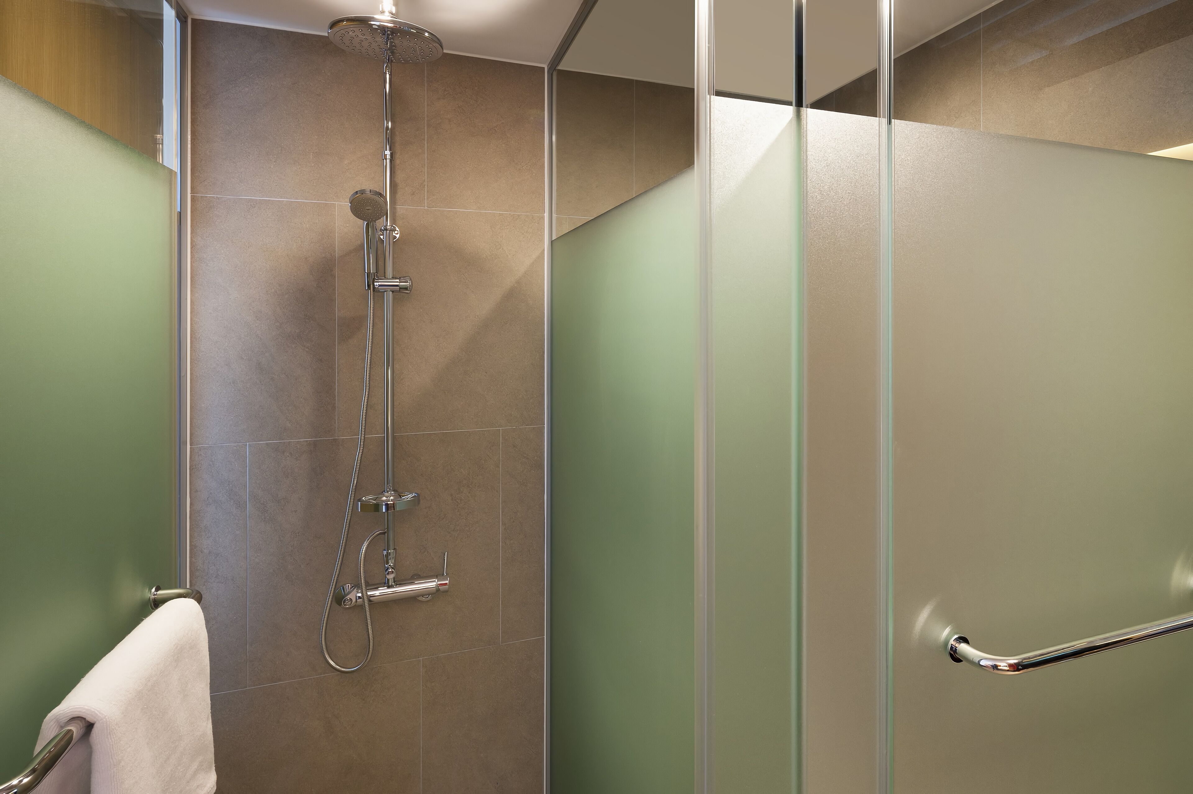 shower, hair dryer, slippers, towels