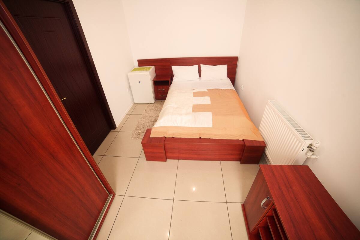 Economy Double Room, Shared Bathroom | Living room | Plasma TV