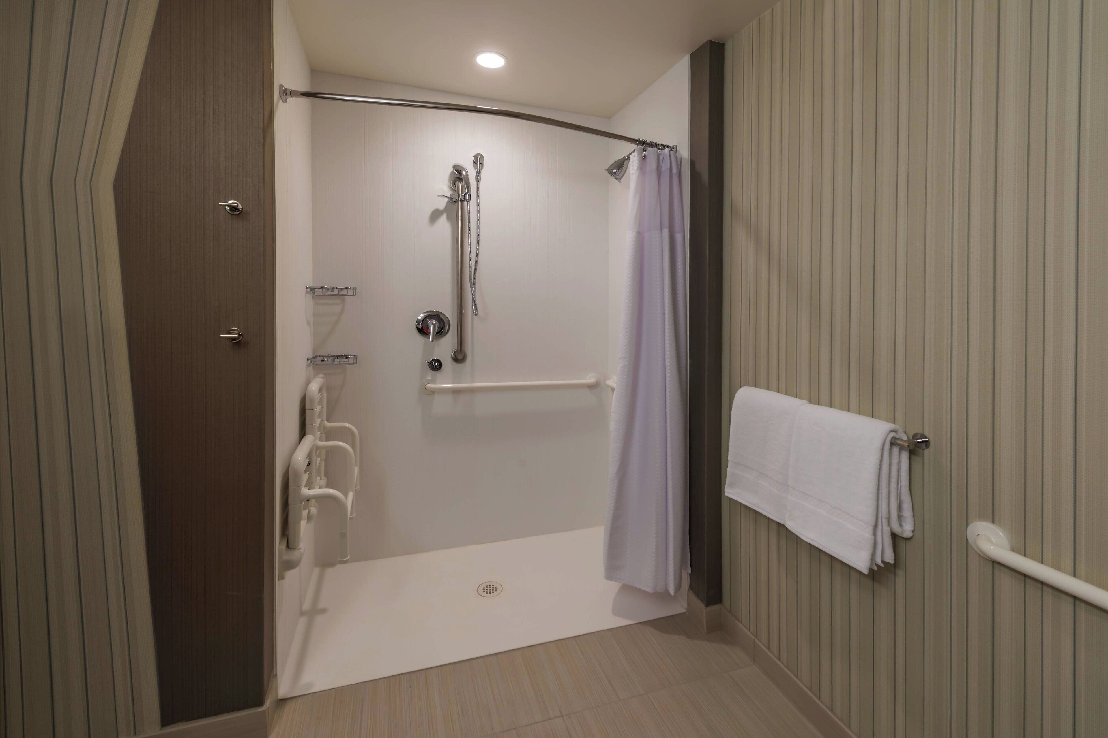 shower, designer toiletries, hair dryer, towels