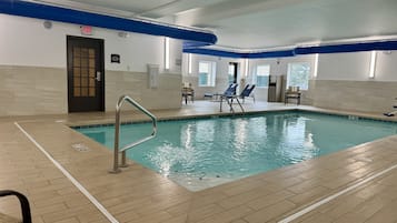 Relax by the pool with lounge chairs and a metal ladder for easy access.