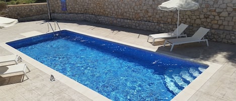 Seasonal outdoor pool, open 8 AM to 8 PM, sun loungers