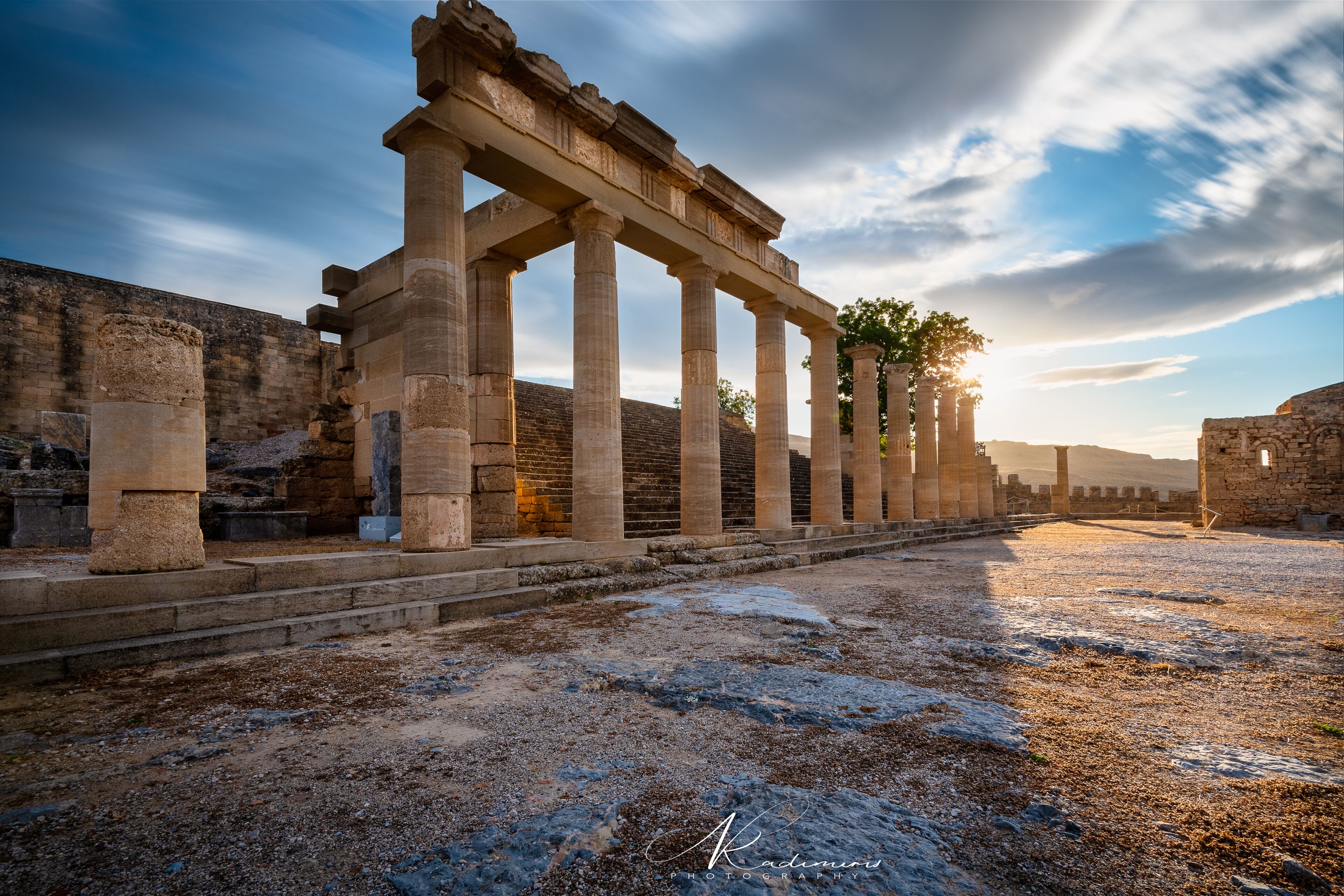 Ancient stone columns and ruins, likely part of a historical site.