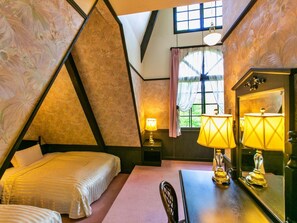 A bedroom with a bed, a desk, two lamps, a mirror, and a window with curtains. - Restaurant & Hotel Traumerei (Hakuba)