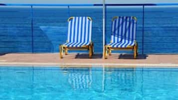 Outdoor pool, pool umbrellas, pool loungers
