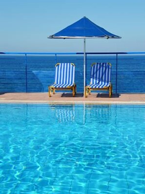 Outdoor pool, pool umbrellas, pool loungers