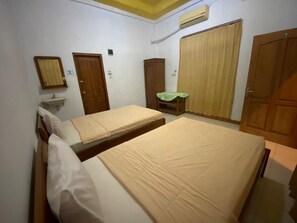 Standard Room AC | Desk, bed sheets