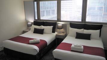 Queen + Double Room | Down comforters, in-room safe, blackout drapes, iron/ironing board
