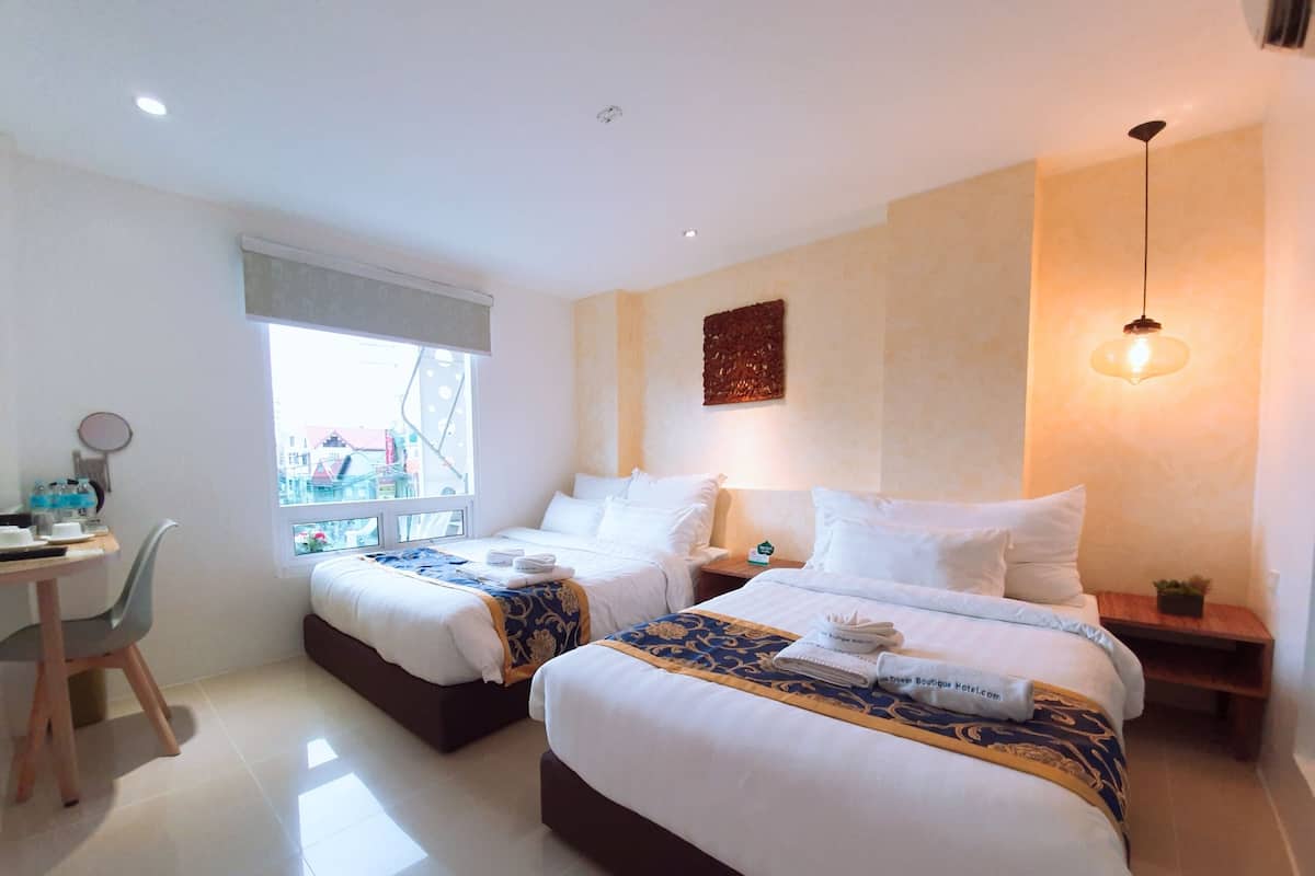 Deluxe Triple Room | Premium bedding, in-room safe, desk, blackout drapes