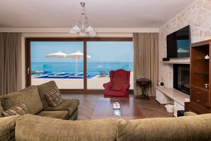 Luxury Villa | Living room | Flat-screen TV, fireplace