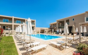 Outdoor pool, pool umbrellas, sun loungers