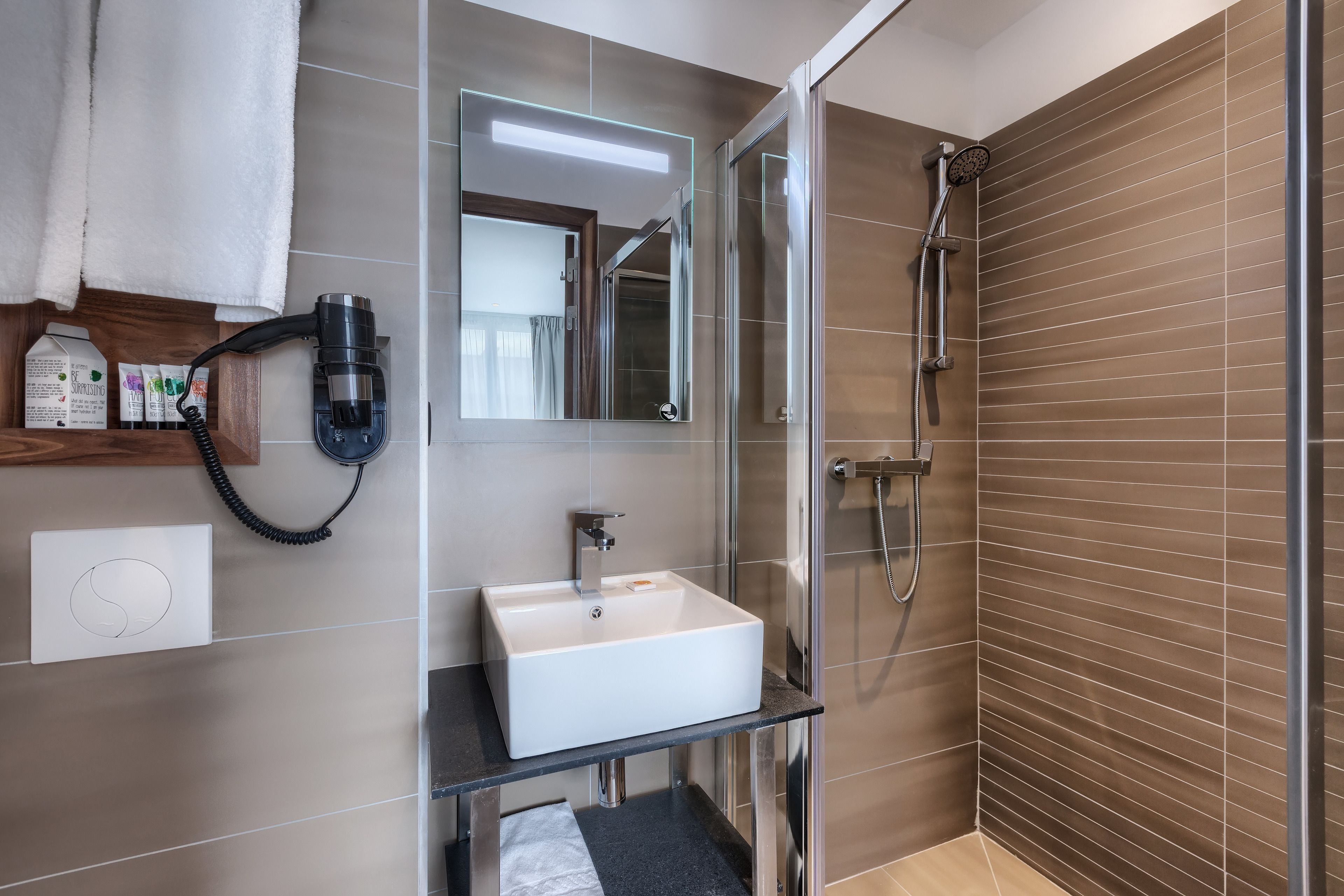 shower, free toiletries, hair dryer, towels