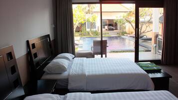 Deluxe Cottage, 1 Double or 2 Single Beds, Pool View, Garden Area | Minibar, in-room safe, desk, cots/infant beds