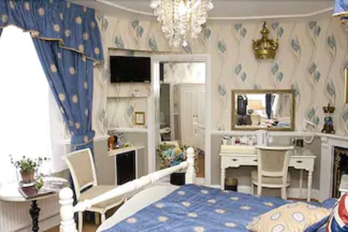 desk, blackout curtains, iron/ironing board, free cots/infant beds