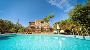 A stone building with a pool in front. - Parys Villas (Zakynthos)