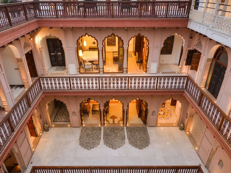 A multi-level courtyard with ornate railings and traditional architecture.