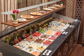 Daily buffet breakfast (USD 25 per person)
