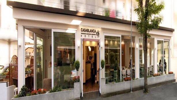 A hotel with a modern facade, large glass windows, and a visible entrance. - Hotel Casablanca (Rimini)