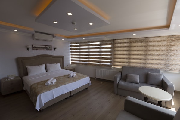 Habitación doble Deluxe, vista al mar | Ropa de cama de alta calidad y minibar