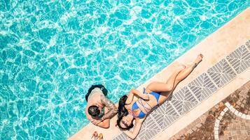 Seasonal outdoor pool, pool umbrellas, pool loungers