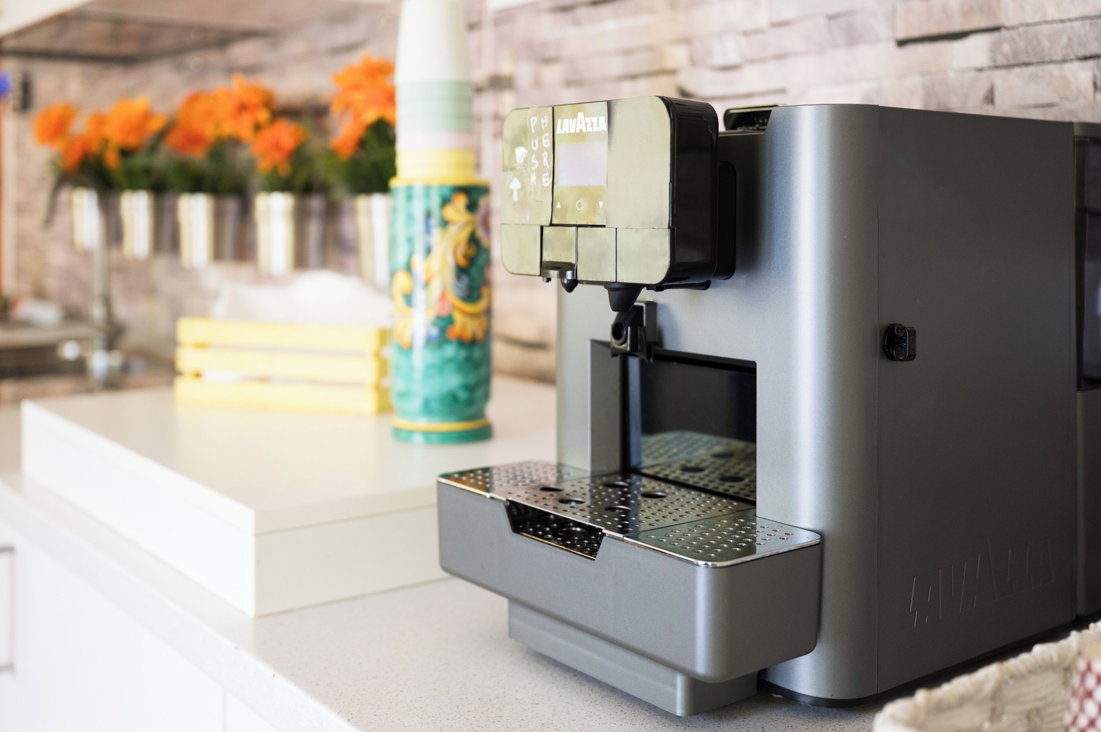 A coffee machine with a control panel on a countertop.