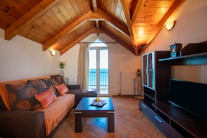 Apartment, 2 Bedrooms, Sea View | Living area | Plasma TV - Psarou Studios (Zakynthos)