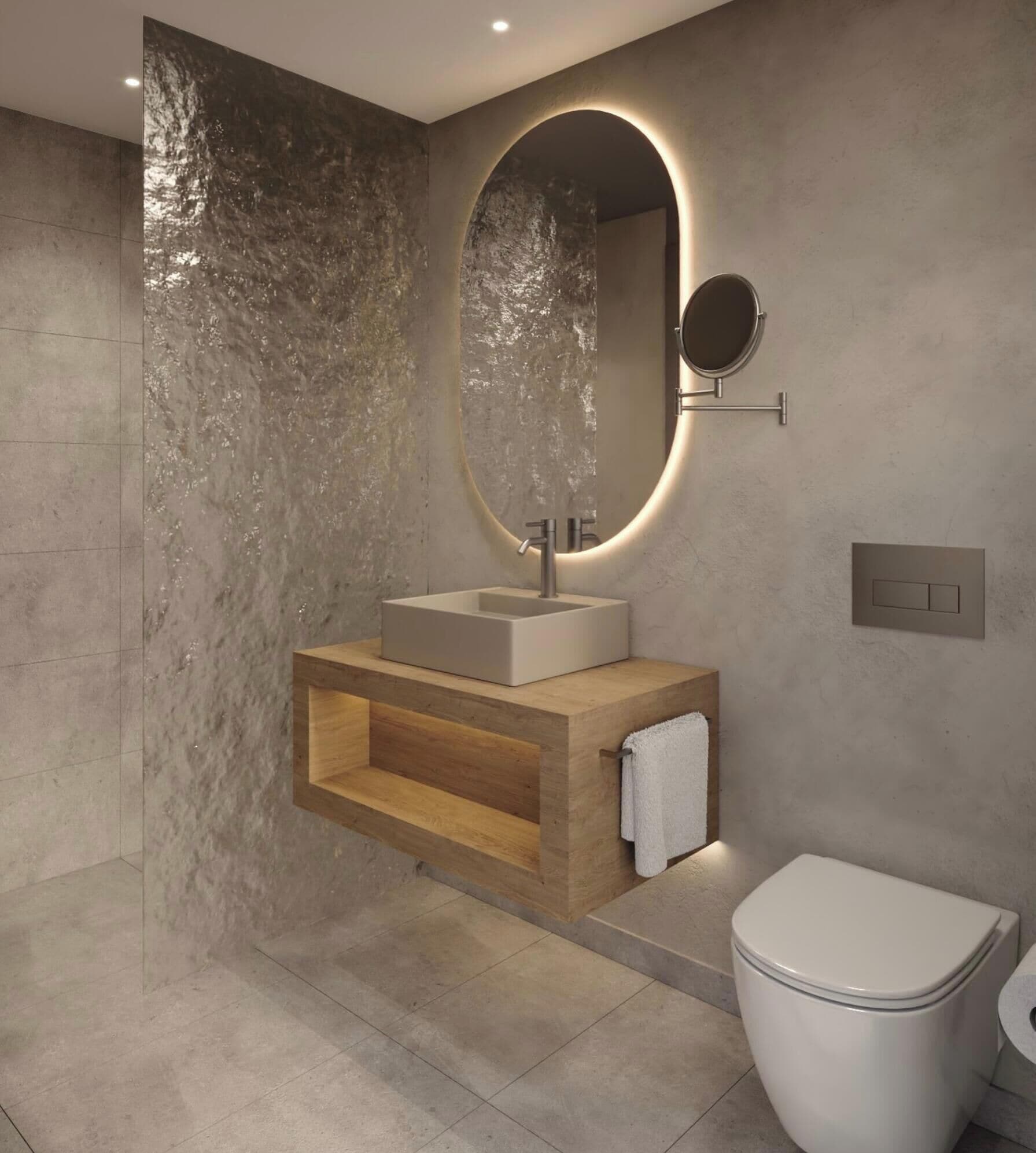 A modern bathroom with a built-in sink, a round mirror, and a toilet.