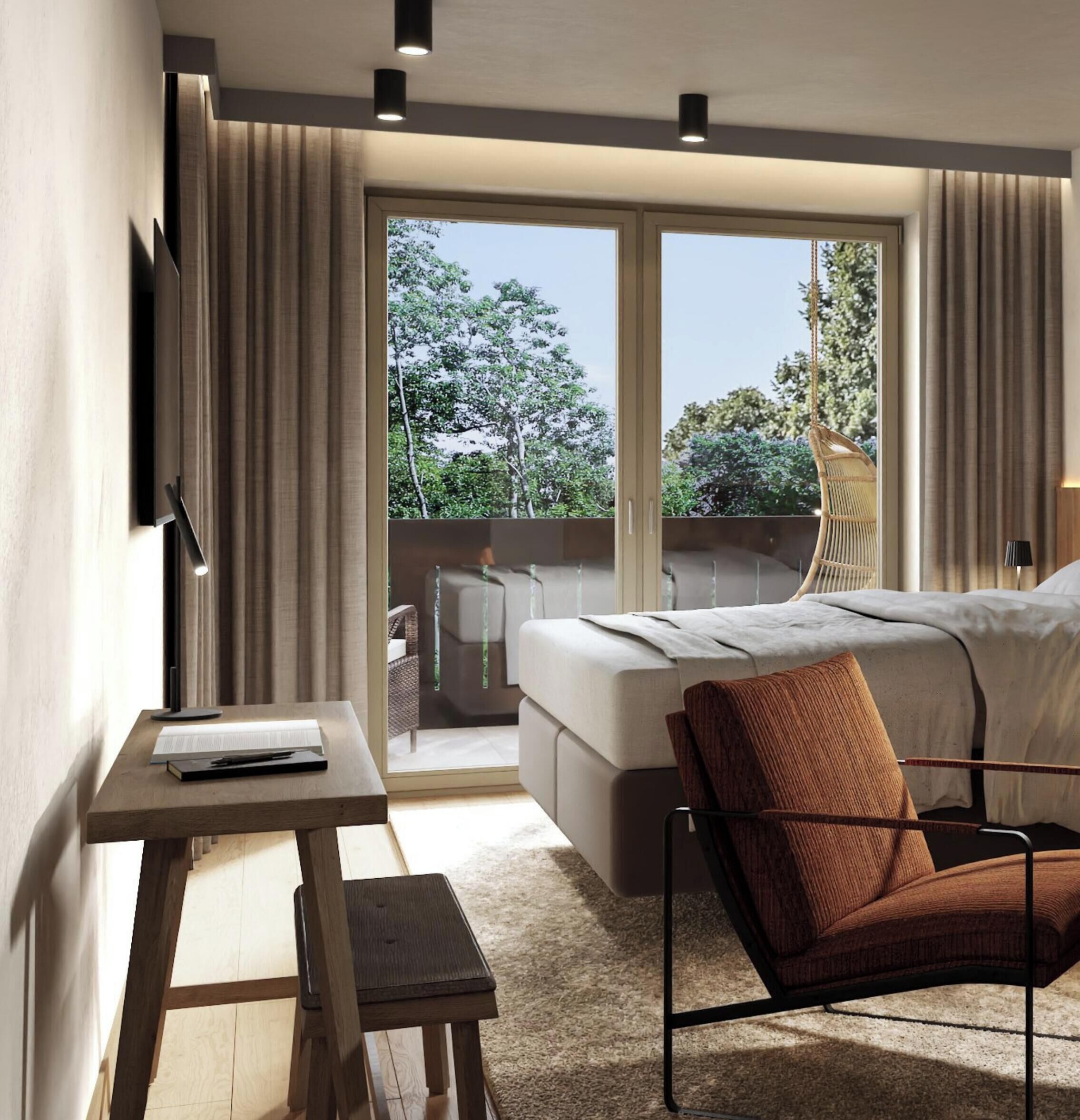 A modern hotel room with a bed, a desk, a chair, and a balcony with a view of trees.