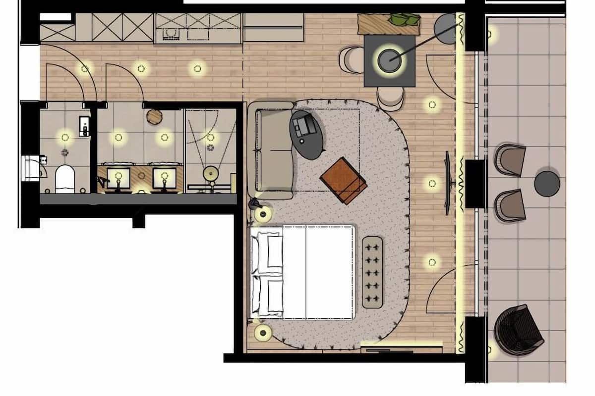 Distribución de una habitación de hotel con cama, escritorio, silla y un pequeño rincón de descanso.
