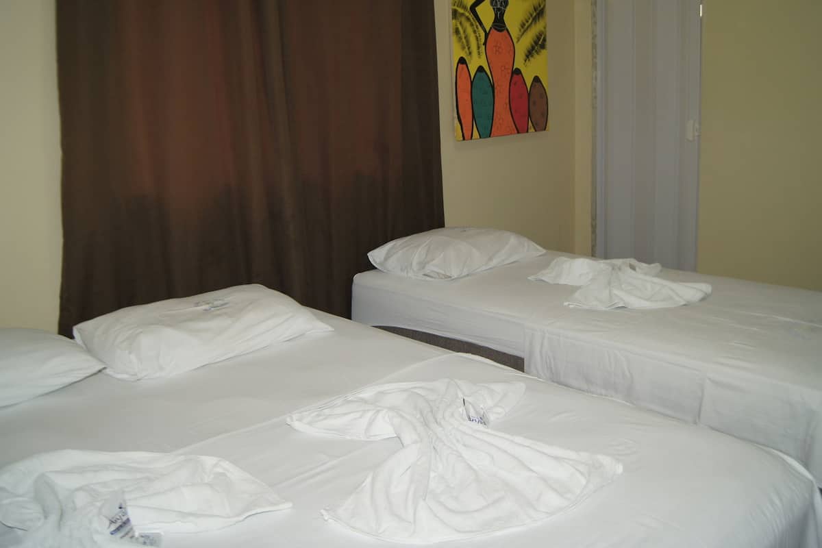 Triple Room | Minibar, blackout drapes, iron/ironing board, free WiFi