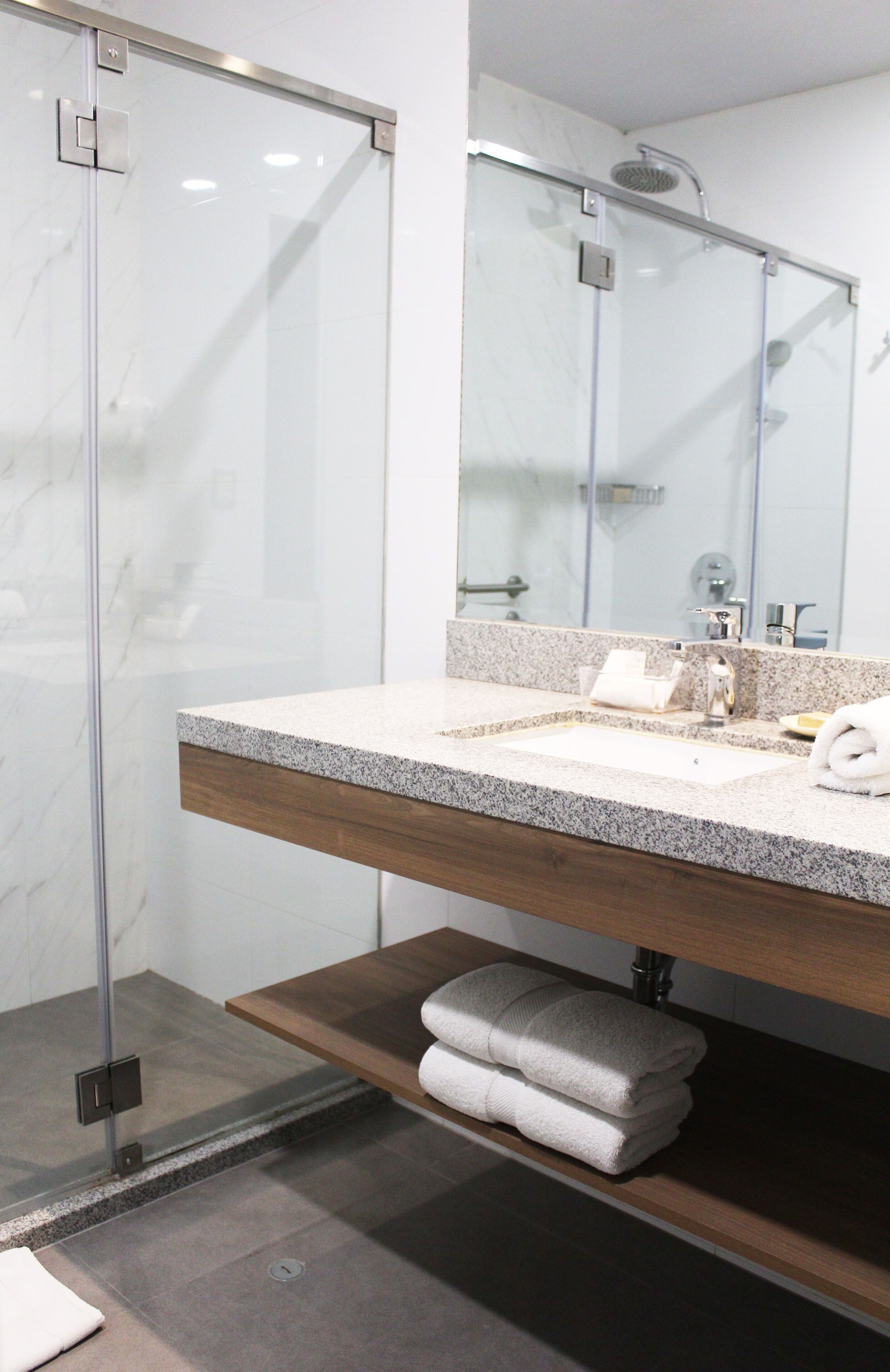 junior studio suite | bathroom | shower, rainfall showerhead, free toiletries, hair dryer