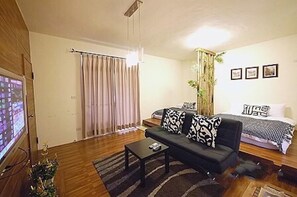 Quad Room, Japanese Style | Living area | Flat-screen TV