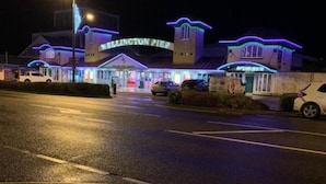 A waterfront hotel with a prominent sign reading "KELLINGTON PIER." - OYO Twins Palms Guest House (Great Yarmouth)