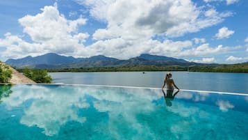 Outdoor pool, open 7:00 AM to 7:00 PM, pool umbrellas, pool loungers