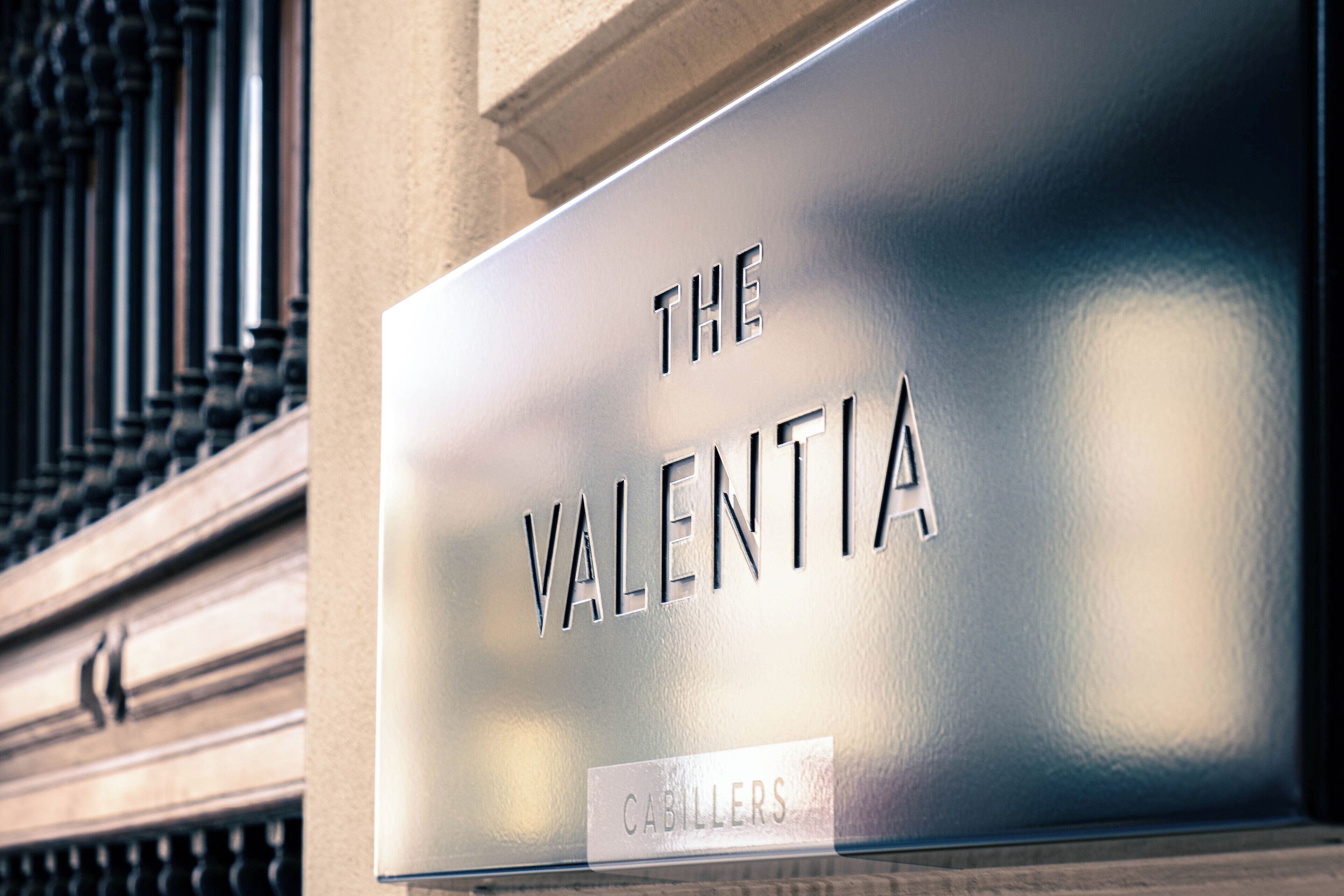 A sign with the name "The Valentia" and "Cabillers" on it.