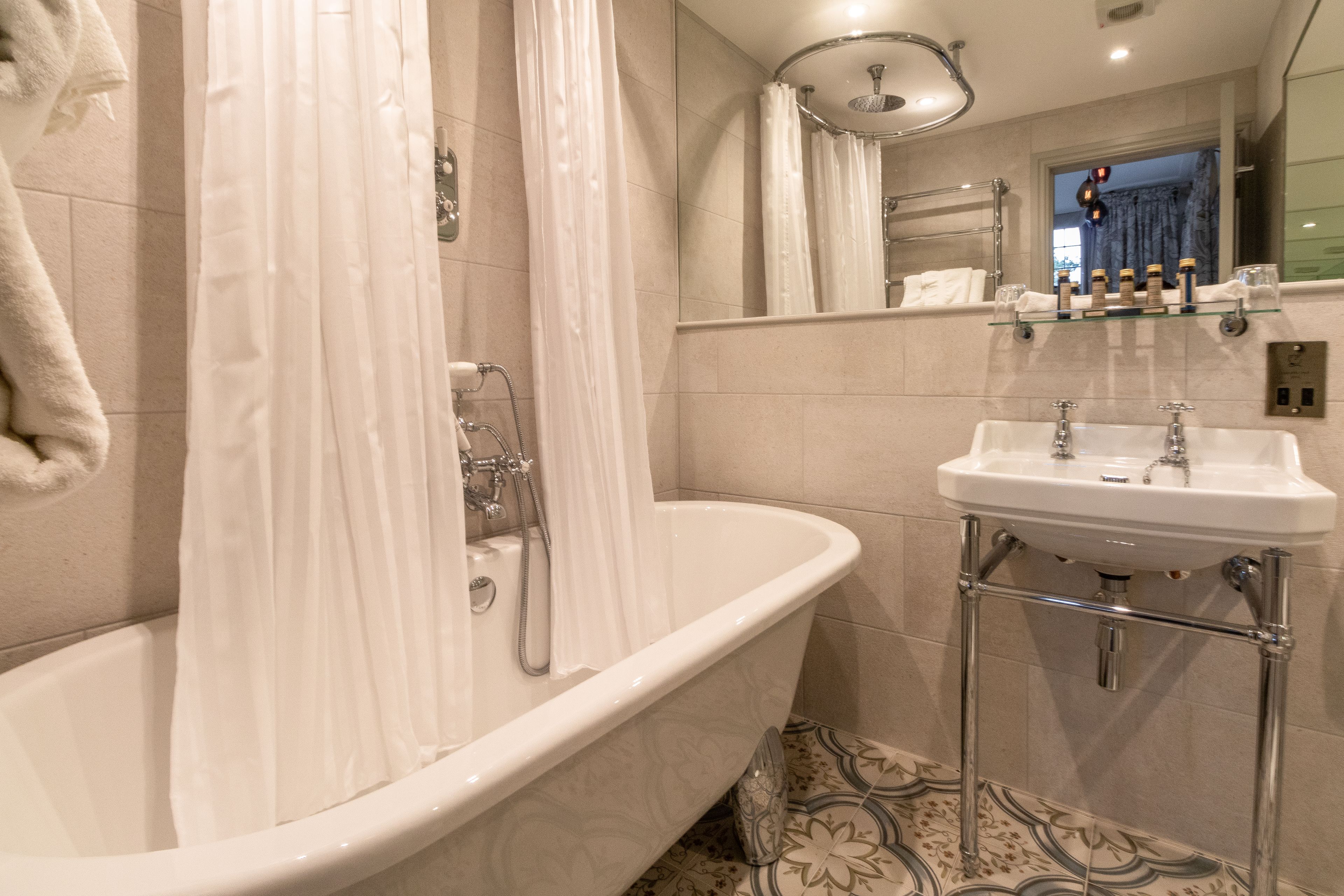 double room (4 poster lake view) | bathroom | free toiletries, hair dryer, towels