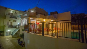 A residential building with a swimming pool, a staircase, and a parked scooter. - Malia Central (Hersonissos)