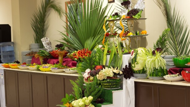 A buffet table with various food items and decorative plants. - Ares Dream Hotel- All Inclusive (Kemer)