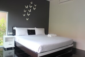 Habitación superior | Escritorio, camas supletorias, wifi gratis