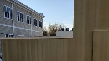A building with a beige exterior and a flat roof.
