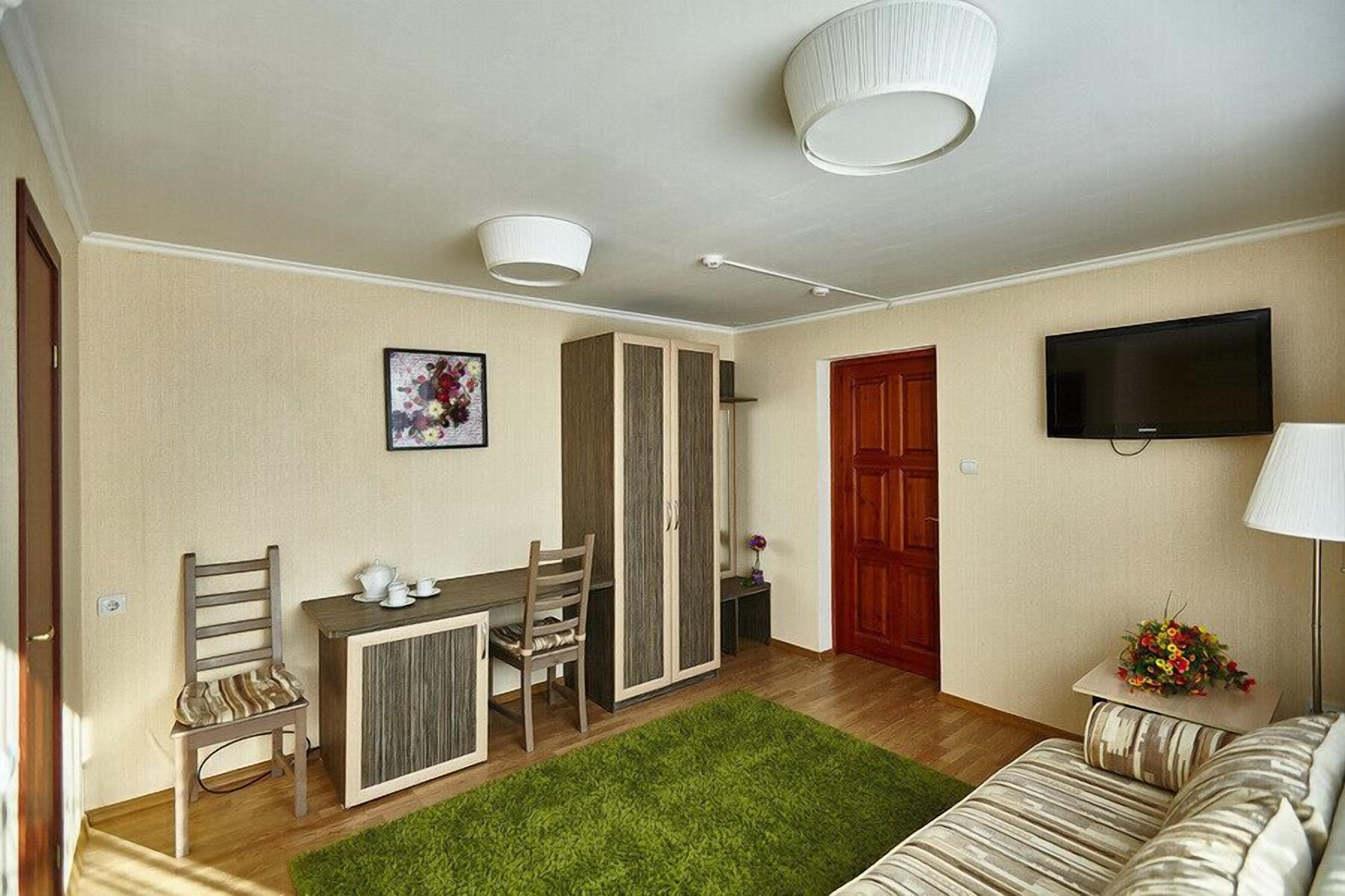 Deluxe Double Room | Living area | LCD TV