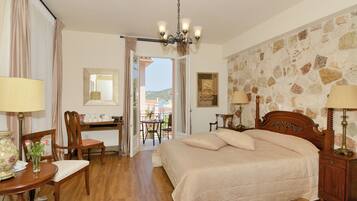 Deluxe Suite, Sea View | Free minibar items, in-room safe, desk, soundproofing