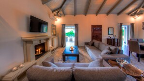 Villa, 4 Bedrooms | Living room | 42-inch flat-screen TV with satellite channels, TV