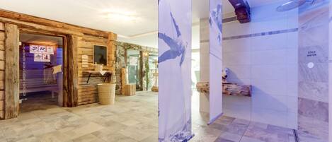 A spa area with a wooden interior, a stone wall, and a tiled floor.