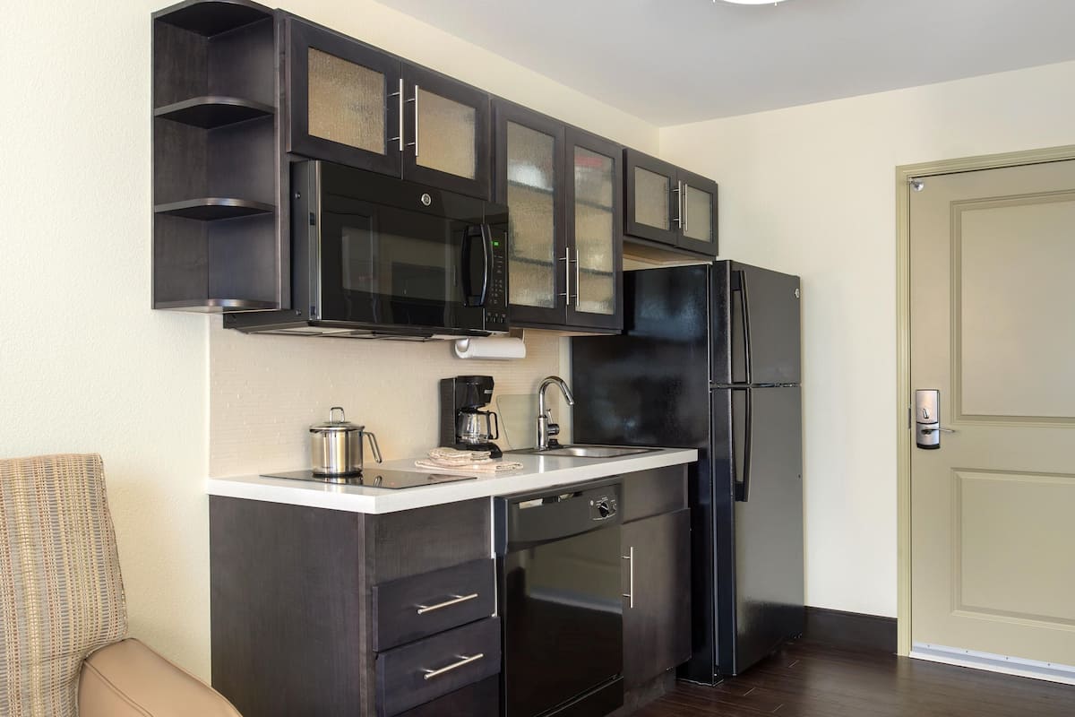 desk, laptop workspace, blackout curtains, iron/ironing board