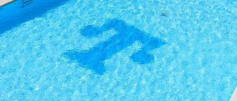Seasonal outdoor pool, pool loungers