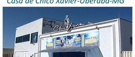 A two-story building with a sign reading "Casa de Chico Xavier-Uberaba-MG".