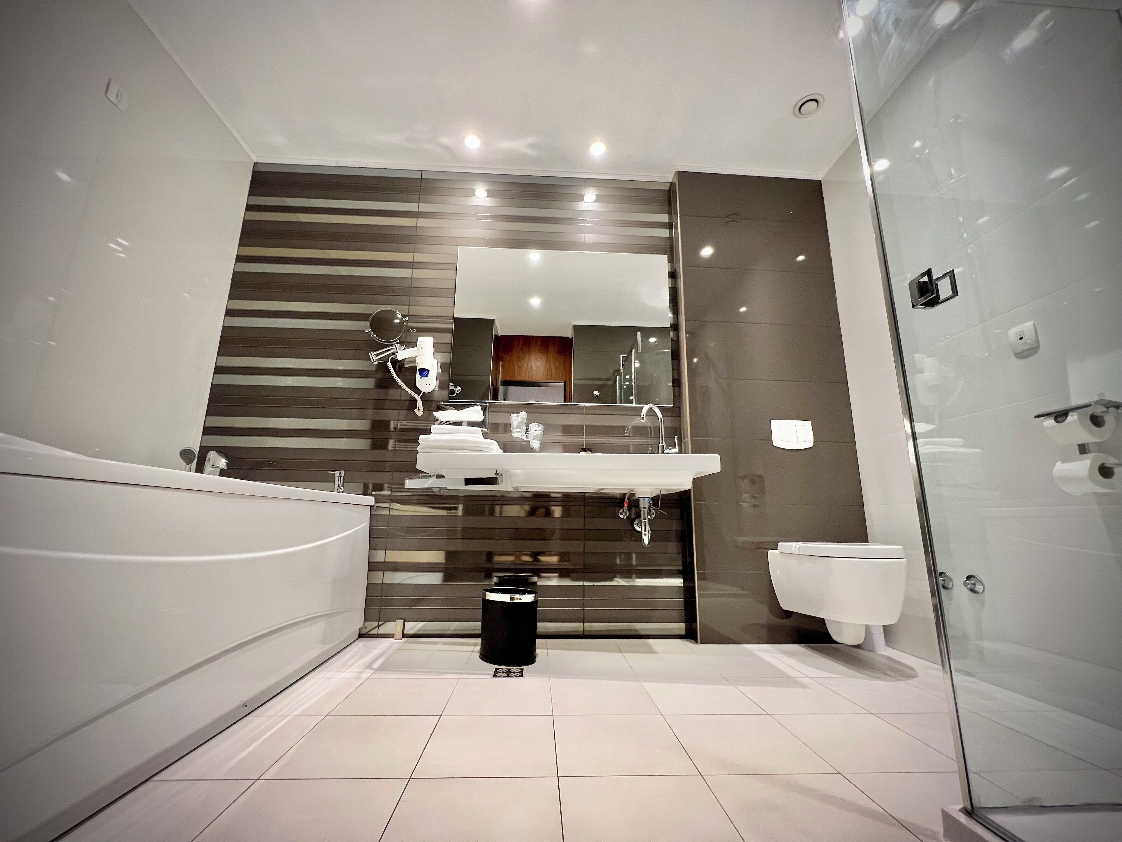 separate bathtub and shower, free toiletries, hair dryer, slippers