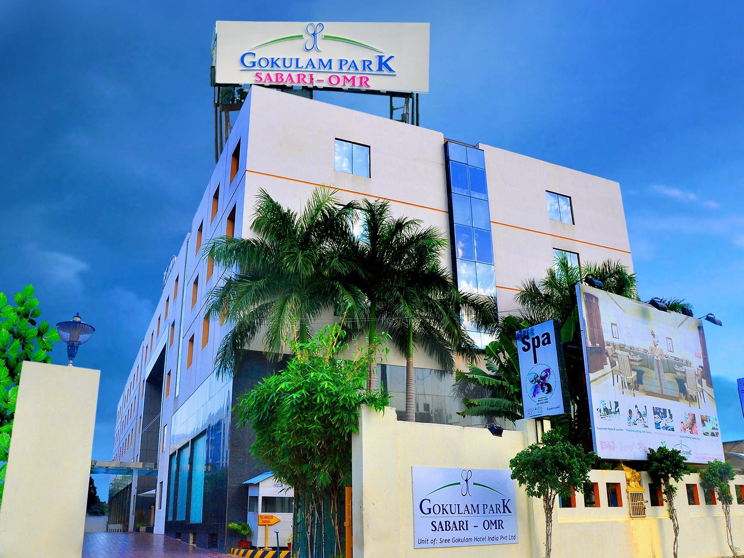 A multi-story hotel with a sign reading 'Gokulam Park Sabari - OMR'.