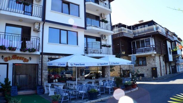 A multi-story hotel with outdoor seating and balconies. - Saint George Nessebar (Nessebar)