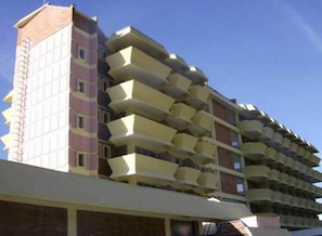 A multi-story building with a unique architectural design featuring staggered balconies. - Metropol Hotel (Ohrid)